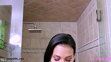 a stunning brunette steps into steamy shower for solo tease