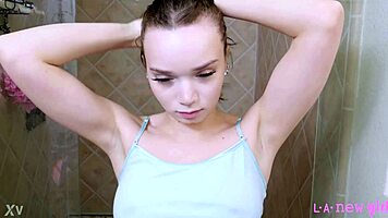 Fierce brunette stunner slips into steamy shower seduction