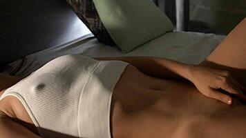 Petite Tattooed Brunette Achieves Multiple Orgasms in Close-Up Solo Fingering