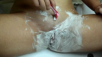 Thrilling close-up razor shave smooths juicy wet pussy