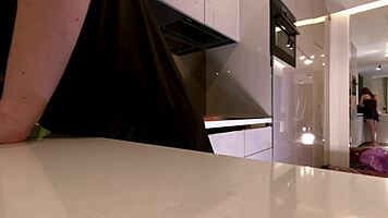 Sexy long-legged brunette teases fishnets satin in kitchen!