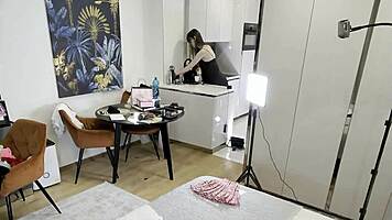 Sexy long-legged brunette teases fishnets satin in kitchen!