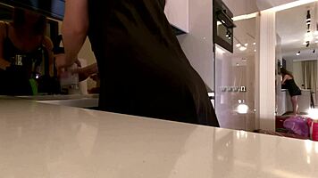 Sexy long-legged brunette teases fishnets satin in kitchen!