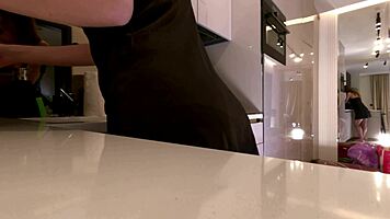 Sexy long-legged brunette teases fishnets satin in kitchen!
