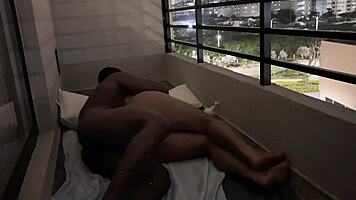 Cute brunette amateur couple fucks passionately on hotel balcony