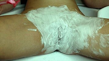 i watch in awe as she shaves her super hairy PUSSY close-up with trimmer then razor getting it smooth and WET