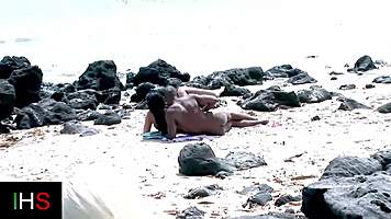 Amazing brunette fucked by black cock on beach while watched