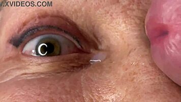 mature lady takes huge facecum load right on her eyes