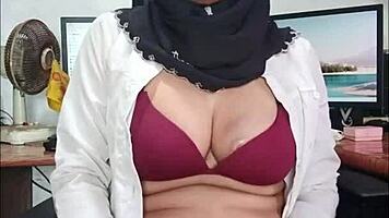 Hijab Asian ladyboy strokes cock in seductive solo tease