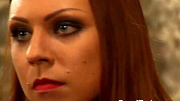 dominant madame whips two bound lesbian slaves in intense session