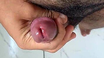 Brazilian solo ass tease handjob strokes huge cock in bathroom mirror