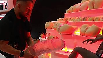 brunette babe rides giant cock at intimix expo event