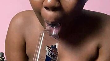 ebony beauty fingers wet hairy pussy with bottle then creamy cum finish