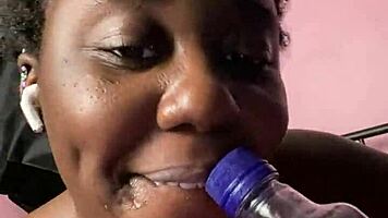ebony beauty fingers wet hairy pussy with bottle then creamy cum finish