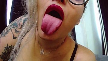 young blonde teases in sexy black outfit and lipstick