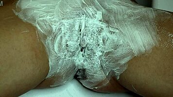 Closeup pussy shaved smooth with trimmer and razor