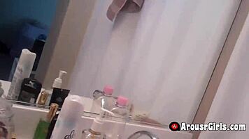 A hot blonde teases her tight pussy on phone cam.