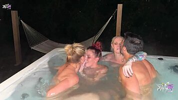 three blondes enjoy outdoor tub fun