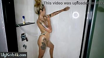 asian teen posed in shower exposing her perfect big ass
