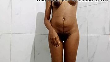 Brunette milf rubs clit and fingers to orgasm in bath