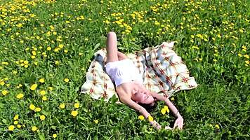 Ananta masturbates on sunny field