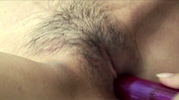 These two asian girls fuck hard with strapon