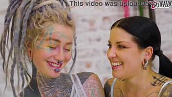 tattooed girl takes full fist in pussy and ass