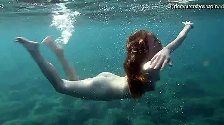 In Tenerife, Hot Ginger Teen 18+ Swims Underwater, Showing Off Bikini in Public Pool Scene