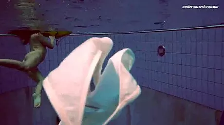 Petite 18+ brunette pornstar Alla swims naked in the hot pool, showing off her horny tits and ass while smoking