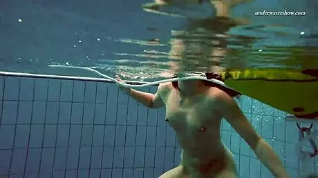 Petite 18+ brunette pornstar Alla swims naked in the hot pool, showing off her horny tits and ass while smoking