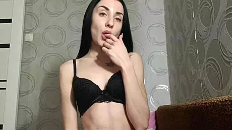 40-kilo girl spreads legs and plays with her cunt