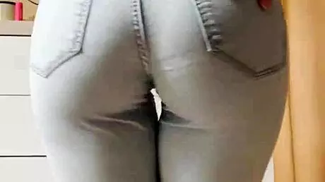 Petite Blonde Performs Seductive Striptease In Tight Jeans