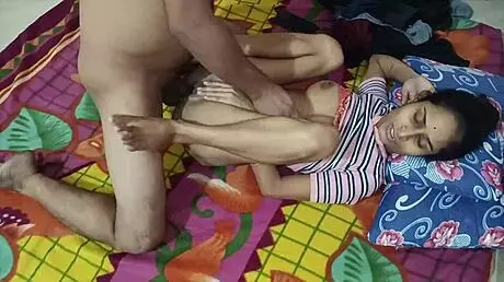 Lonely Indian housewife teases her body with fingers on the sofa.