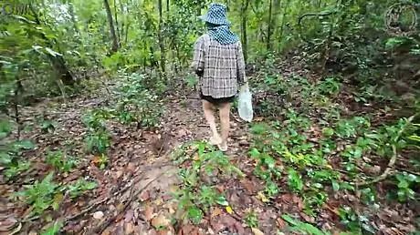thai girl chats while picking mushrooms in the forest 😊