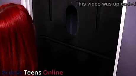 Redhead nurse sucks cock at gloryhole